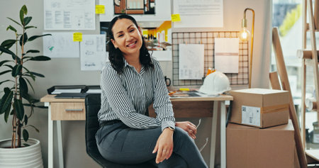 Business woman, architect and portrait in office for startup project, floor plan or building research. Professional person, designer or engineer with smile for blueprint, ideas or creative consultantの写真素材