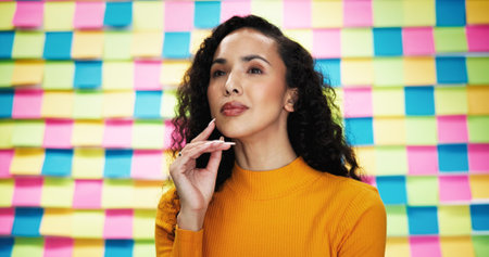 Creative, thinking and business woman with sticky note for problem solving, project ideas and agenda. Studio, female person and proud designer with thoughts for planning, solution and brainstormingの写真素材