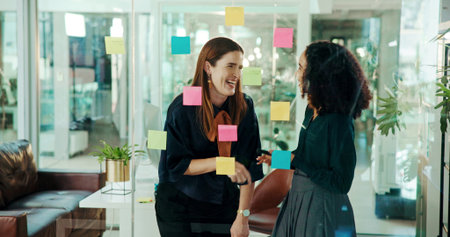Business women, laughing and chatting with funny joke, conversation or talk for social or break at...