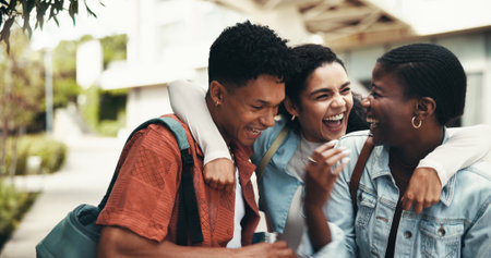 University student, friends and laughing together outdoor for funny joke, gossip story and bonding. Education, people and humor on campus for learning break, fun conversation and study support groupの写真素材
