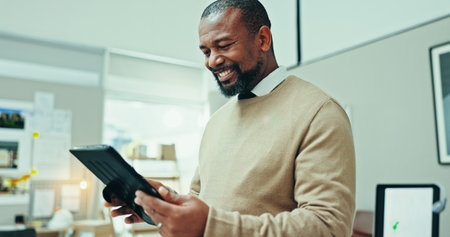 Businessman, smile or tablet in office for research online for real estate opportunity or listing services. African person, realtor and browsing housing website for apartment, ideas and property adsの写真素材