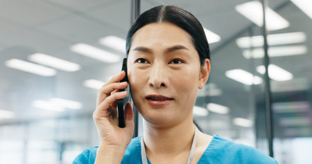 Woman, surgeon or phone call at hospital for healthcare service support or medical results in office. Mobile, Asian nurse or talking to patient for consultation advice or appointment booking in Japanの写真素材