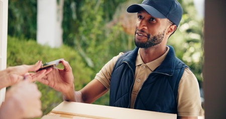 Man, delivery and box with phone at door for shipment app, online service or distribution at house. Male person, distributor or courier guy with customer or mobile smartphone for order confirmationの写真素材