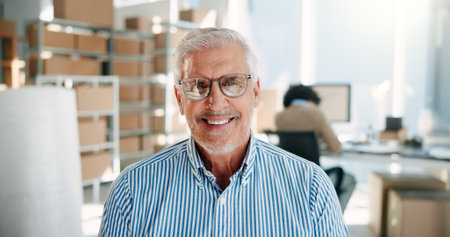 Portrait, manager and happy man in small business for logistics, supply chain or startup experience. Warehouse, face and mature person at work with glasses for professional distribution or shippingの写真素材