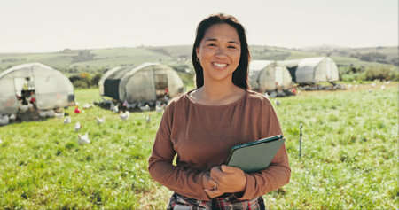 Portrait, farm and woman with tablet, agriculture and countryside with sustainability, network and connection. Happy person, environment and farmer with tech and digital app for online weather reportの写真素材