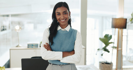 Smile, journalist and portrait of woman with arms crossed for professional, pride and entrepreneur in office. Creative, consultant or news editor for publishing, content creation and press startupの写真素材