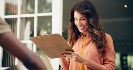 Courier, signature and clipboard with woman and delivery for shipping, ecommerce and supply chain. Online shopping order, logistics and distribution with customer at home for package and cargoの写真素材