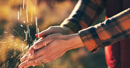 Person, farmer and washing hands with water for hygiene, disinfection or rinse in nature. Closeup, sustainability and liquid drops with cleanse or sanitary for agriculture or agro business on farmの写真素材