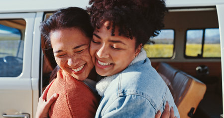 Hug, road trip and car with women, smile and love for journey and countryside travel. Happy friends, transport and bonding for summer adventure, holiday break and outdoor vacation with van vehicleの写真素材