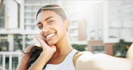 Fitness, portrait and woman in city with selfie, smile and workout or exercise for training break on social media. Happy influencer, runner and girl in profile picture for online post or health vlogの写真素材