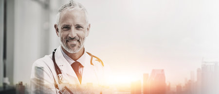 Healthcare, doctor and city portrait with double exposure for public health assistance, medicine support and pride. Banner, mature professional and happy man on mockup space for medical insuranceの写真素材