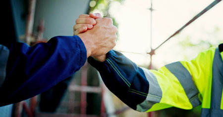 Engineering, closeup and business people with handshake, partnership and contractor. Employees, architecture and collaboration with thank you, greeting and planning for building project and dealの写真素材