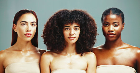 Women, inclusion and portrait for skincare in studio background for diverse beauty. Natural, people and satisfied with glow in confidence with empowerment, body care and skin treatment or supportの写真素材