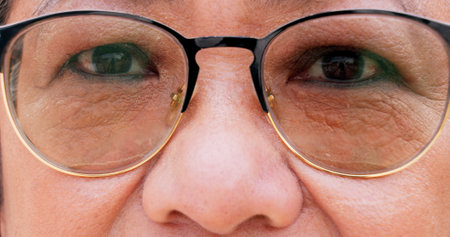 Optometry, glasses and eyes of mature woman for vision, health and wellness with prescription. Spectacles, portrait and female person with lens and frame for optical care or eyesight improvement.の写真素材