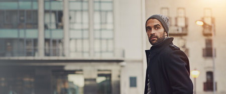 Man, thinking or winter fashion in city for travel, commute or buildings in town banner. Architecture enthusiast, designer style or journey in urban Italy for trip, outdoor or walking for design ideaの写真素材