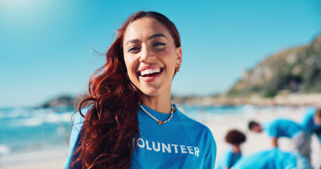 Volunteer, laugh and portrait of woman on beach for cleaning dirt, plastic and litter for ocean pollution. Community service, charity and person for environmental care, recycling and climate changeの写真素材