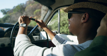 Travel, man and driver on road trip with smile, holiday adventure and weekend fun in countryside. Explore, discover and people driving in car for journey, transport or summer vacation with happy faceの写真素材