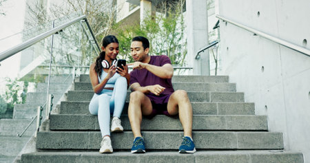 Stairs, city and couple with smartphone, exercise break and smile for support and challenge in New...