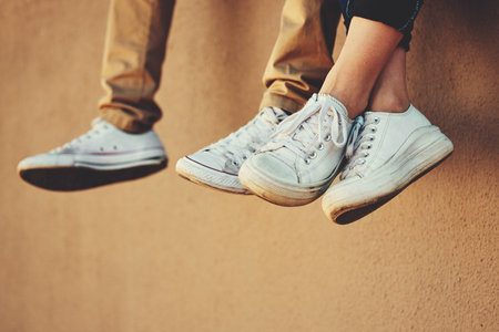 Shoes, building a friends relax outside in summer for bonding, friendship and calm carefree fun....