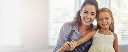 Baking, mom and child in home, portrait and bonding in morning, teaching and smile for daughter in kitchen. Cooking, woman and meal prep with girl, banner and learning in house, care and Canadaの写真素材