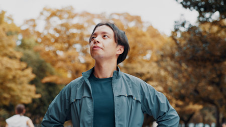 Thinking, nature and man with running for exercise outdoor with health, wellness and activity. Idea, park and male person with cardio workout for marathon, challenge or race training in Japan.の写真素材