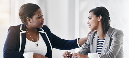 Banner, women and support with comfort, care and solidarity in office as psychologist for company. Female people, empathy and compassion for grief counselling, conversation and mental health at workの写真素材