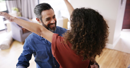 Couple, hug and celebrate moving in flat, relocation goal success and homeowners for mortgage. People, embrace and proud of real estate achievement in new home, support and buy for house securityの写真素材