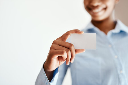 Hand, business card and woman with announcement, paper and mockup space with promotion. Closeup, accountant and employee in workplace, logo and showing with corporate professional and growthの写真素材