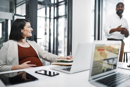 Business, office and happy pregnant woman writing notes, discussion memo or meeting minutes. Pregnancy, work notebook and employee planning schedule, agenda or secretary coworking in creative startupの写真素材