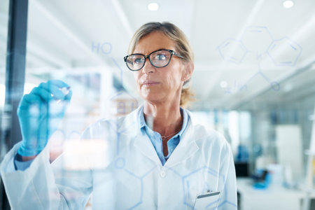 Woman, scientist and formula on glass wall at laboratory for planning, strategy and ideas on medical...