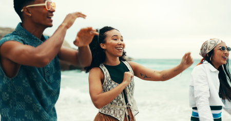 Happy, people and dancing on beach outdoor with energy, movement and vacation reunion for rave...