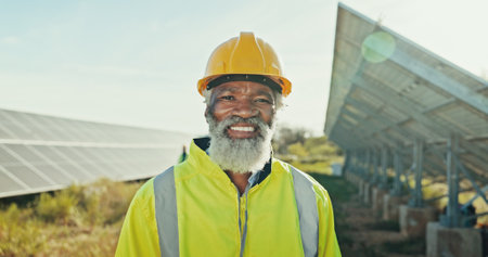 Solar panels, smile and technician with black man in nature for photovoltaic, renewable energy or power generator. Sustainability, electric system or engineer with portrait of person for inspectionの写真素材