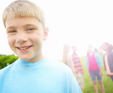 Portrait, group and boy with smile, outdoor and excited with nature, summer holiday and break. Face,...