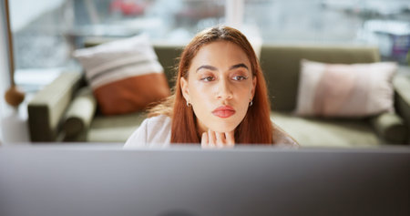 Computer, reading and business woman in office for interior design portfolio, research and realtor...