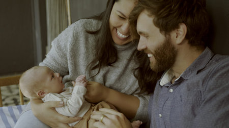 Happy, newborn and parents with baby as love, care or bonding in a home as affection together....
