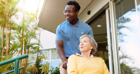 Senior woman, nurse and wheelchair with caregiver for walk, support or assisted living in garden....