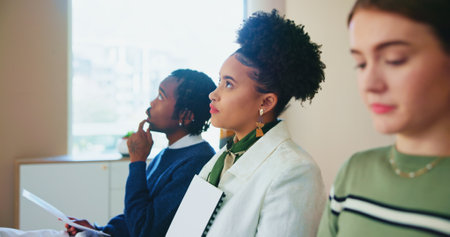 Thinking, hiring and business people in waiting room for interview at startup for fashion magazine editing. Cv, recruitment and group prepare for job search, hr and creative decision with competitionの写真素材