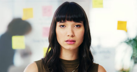 Creative, serious and portrait of business woman in office for planning, brainstorming and ideas for...