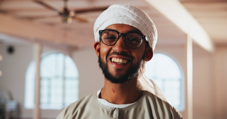 Happy, mosque and portrait of Muslim man for prayer, worship and faith with smile in religious building. Religion, Allah and person for praying, culture and Islamic belief in Saudi Arabia templeの写真素材
