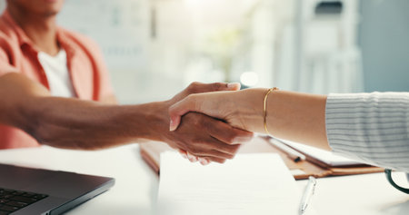 Handshake, meeting and hands of business people in office for agreement, partnership and thank you. Professional, creative company and worker with boss for project approval, agreement and discussionの写真素材