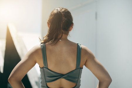 Fitness, back and rear view of woman outdoors for training, exercise or morning cardio preparation. Sport, workout and behind athletic girl getting ready for running, marathon and sports routineの写真素材