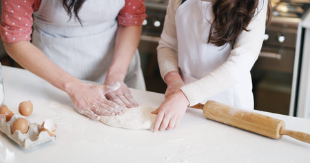 Hands, cooking and mother with child in kitchen with dough for learning with pizza dinner. Rolling...
