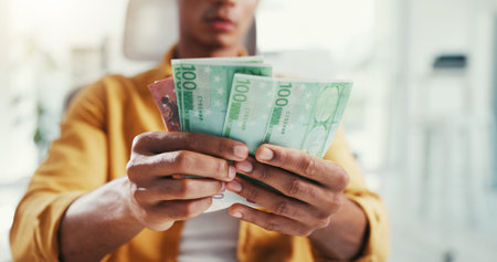 Man, hands and counting money in office, savings and account for financial revenue. Male person,...