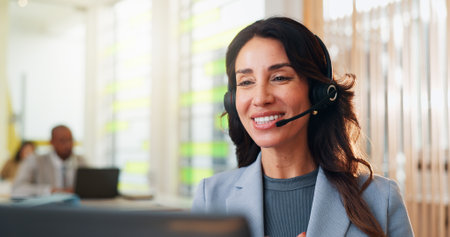 Business, telemarketing and woman in office, smile and tech support with advice. Person, consultant and employee in workplace, headset or communication with customer service, help desk or call centerの写真素材