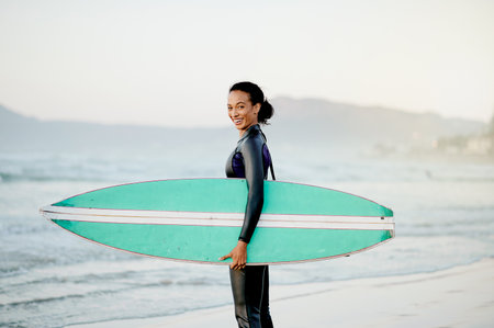 Portrait, surfboard or happy woman at sea for fitness training, workout or sports exercise on Hawaii beach. Smile, surfer or mixed race girl smiling on fun summer holiday vacation ready for surfingの写真素材