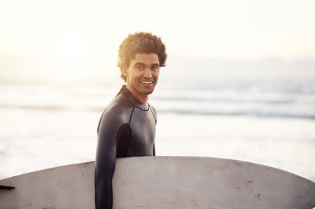 Happy, surfer or man portrait at sea for fitness training, workout or sports exercise on Hawaii sunrise mockup. Surfing, surfboard or athlete smiling on fun summer holiday vacation on beach or natureの写真素材