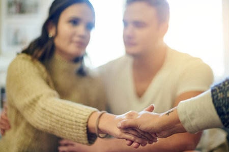 Therapy, counseling and therapist holding hands for couple session, consulting and relationship...