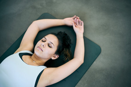 Sleep, meditation and a woman on the floor for fitness, mindfulness and training focus at the gym....