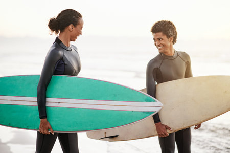 Surfing, sports and friends on the beach together during summer for training, fun or recreation....