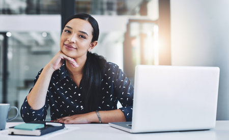 Woman, portrait or laptop in office for business, relax or smile for career development. Accountant, tech or happy in Brazil agency for opportunity, finance management and pride for employee feedbackの写真素材